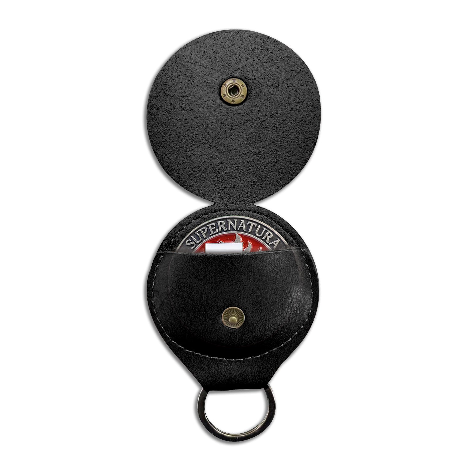 A round, black coin holder with a key ring, spread open. In the coin holder slot, the top edge of a brass coin is partially sticking out. A brass snap fastener is in the center of each section of the coin holder.