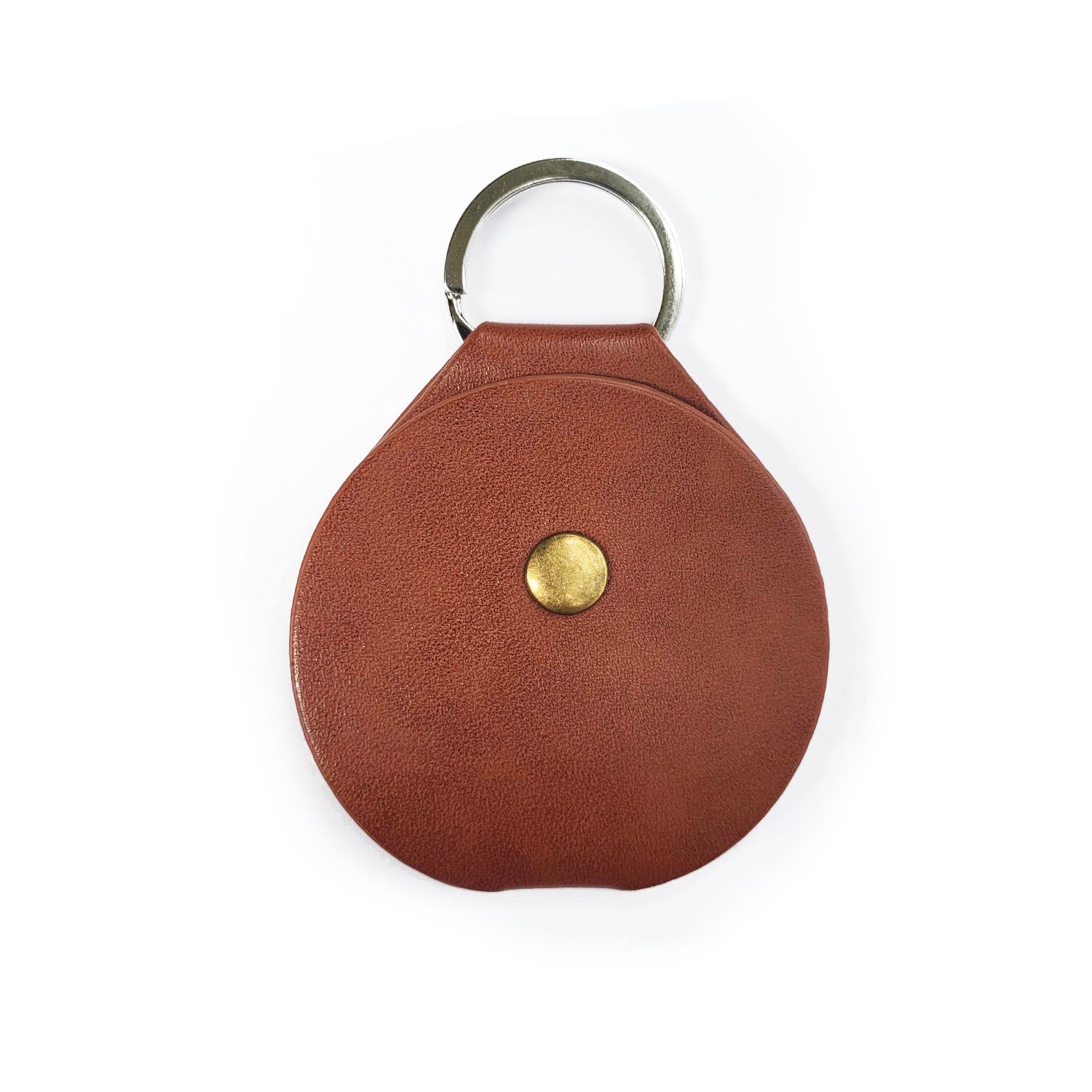 A round, leathery coin holder with a key ring at the top. In the center is a brass button that fastens the coin holder.