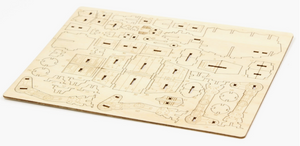 A flat wooden sheet off of the model parts, to be punched out and assembled.