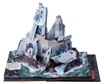 An image of a pop-up page from the book, on a white background. A white stone castle rises from the sea. Adventurers face off against various monsters throughout the castle.